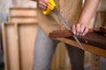 Close-up view of a joiner sawing wood Royalty Free Stock Photo