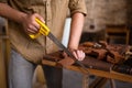 Close-up view of a joiner sawing wood Royalty Free Stock Photo