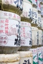 Close up view of Kazaridaru, the decorative wall of stacked Japanese sake barrels