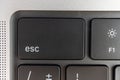 Close-up view of a keyboard corner, with Esc key highlighted Partially visible keys and power button Suggests navigation Royalty Free Stock Photo