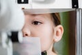 close up view of kid examining eyesight 
