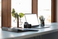 Close up view of laptop computer with blank white screen with office supplies in modern office Royalty Free Stock Photo