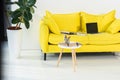 close up view of laptop, notebooks and folders on yellow sofa at home office Royalty Free Stock Photo