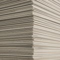 A close-up view of a large stack of cardboard sheets. The sheets are uniformly cut Royalty Free Stock Photo
