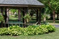 Close up view of large wooden gazebo in a public park