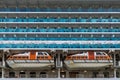 Close up view of life boats and exterior board cabins on a large cruise ship