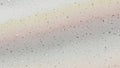 Subtle Rainbow Hues and Speckled Texture on a Light Colored Surface Background abstract Royalty Free Stock Photo