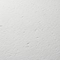 Close-up view of a lightly textured white surface with subtle marks Royalty Free Stock Photo