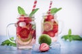 Close up view on lime and strawberry detox drink in glass mason jars on a blue background 12 Royalty Free Stock Photo