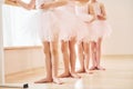 Close up view. Little ballerinas preparing for performance by practicing dance moves