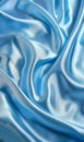 A close-up view of a luxurious blue satin fabric, with elegant light reflections and smooth waves creating an abstract