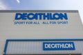 Close up view of main logo of sport market Decathlon on facade of building.