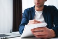 Close-up view on male hand and notepad writing business ideas at openspace Royalty Free Stock Photo