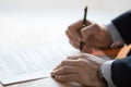 Close up view of male hand signing business contract concept Royalty Free Stock Photo