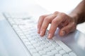 Close up view of a male hand typing on keyboard Royalty Free Stock Photo