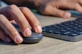 Close up view of male hands on computer keyboard and mouse Royalty Free Stock Photo