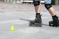 Close-up view of male legs in roller skates. Figure skating on roller skates