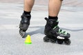 Close-up view of male legs in roller skates. Figure skating on roller skates