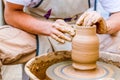 Pottery artist making clay pot in a workshop Royalty Free Stock Photo