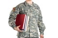 Close up view of male in US Army soldier ISAF uniform holding a books