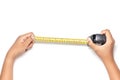 Close up view of man hand holding Tape measure. Human hands ,  on white background measuring with construction roulette. Royalty Free Stock Photo