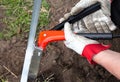 Close up view of man hand use rivet gun.