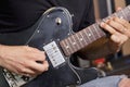 Close-up view of man playing electric guitar Royalty Free Stock Photo