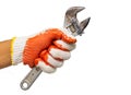 A man`s hand holding adjustable wrench isolated on white background. Mechanic and repairman. Handyman. DIY Royalty Free Stock Photo