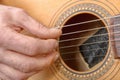 Close-up view of man`s hand playing guitar Royalty Free Stock Photo