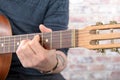 Close-up view of man`s hand playing guitar Royalty Free Stock Photo