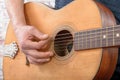 Close-up view of man`s hand playing guitar Royalty Free Stock Photo