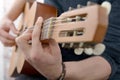 Close-up view of man`s hand playing guitar Royalty Free Stock Photo