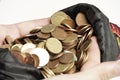 close up view of man's hands grabbing many coins on a white background. economic concept of profit Royalty Free Stock Photo