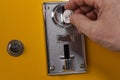 Close up view of man throwing down coins to slot machine Royalty Free Stock Photo
