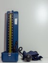 Close-up view of a manual sphygmomanometer placed against a white background. Royalty Free Stock Photo