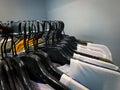 Close up view of many hangers with clothes. Royalty Free Stock Photo
