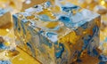 close-up view marble-patterned cube, with mix blue, yellow, and white colors, sits on yellow surface with Royalty Free Stock Photo
