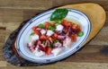a marinated octopus with olive, pepper, tomato on plate Royalty Free Stock Photo