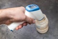 Close up view of measuring water temperature for infants. Preparation of baby milk powder. Measurement with a non-contact