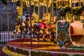 Close up view of Merry-Go-Round carousel illuminated at night. Royalty Free Stock Photo