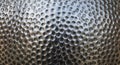 Close-up view of a metallic surface with a perforated and textur Royalty Free Stock Photo
