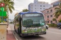 Close-up view of a Miami-Dade bus at a roadside stop in Miami Beach.