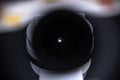 Close-up View of a Microscope Lens with Light Reflections Capturing the Science and Precision of Laboratory Equipment in a Royalty Free Stock Photo