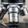 Close-up view of a microscope\'s objective lenses featuring markings for magnification Royalty Free Stock Photo