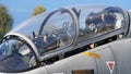 Close up view of military pilots in the cockpit of modern jet training airplane