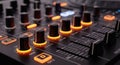 Close-up view of a modern audio mixing console with illuminated knobs and buttons Royalty Free Stock Photo