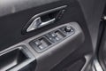 Close up view of modern automobile`s door. Buttons and knobs Royalty Free Stock Photo