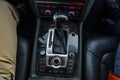 Close-up view of a modern car gearshift and controls on a leather interior Royalty Free Stock Photo
