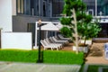 Close up view of modern contemporary miniature model of luxury housing with patio. Focus on the deck chairs. Construction, home
