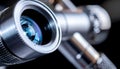 Close Up View of Modern Metallic Microscope with Blue Light Reflection Royalty Free Stock Photo